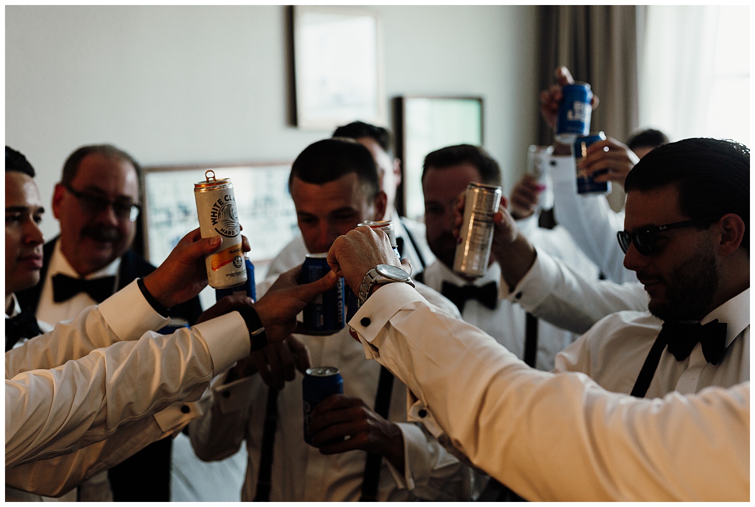 groom and groomsmen toasting in hotel room while getting ready, pink and purple bridesmaid dresses in the AC hotel downtown Nashville, Nashville wedding photography, Country Music Hall of Fame wedding reception, Tennessee wedding Planning, Wedding Inspiration, Engagement Inspiration, Downtown Nashville