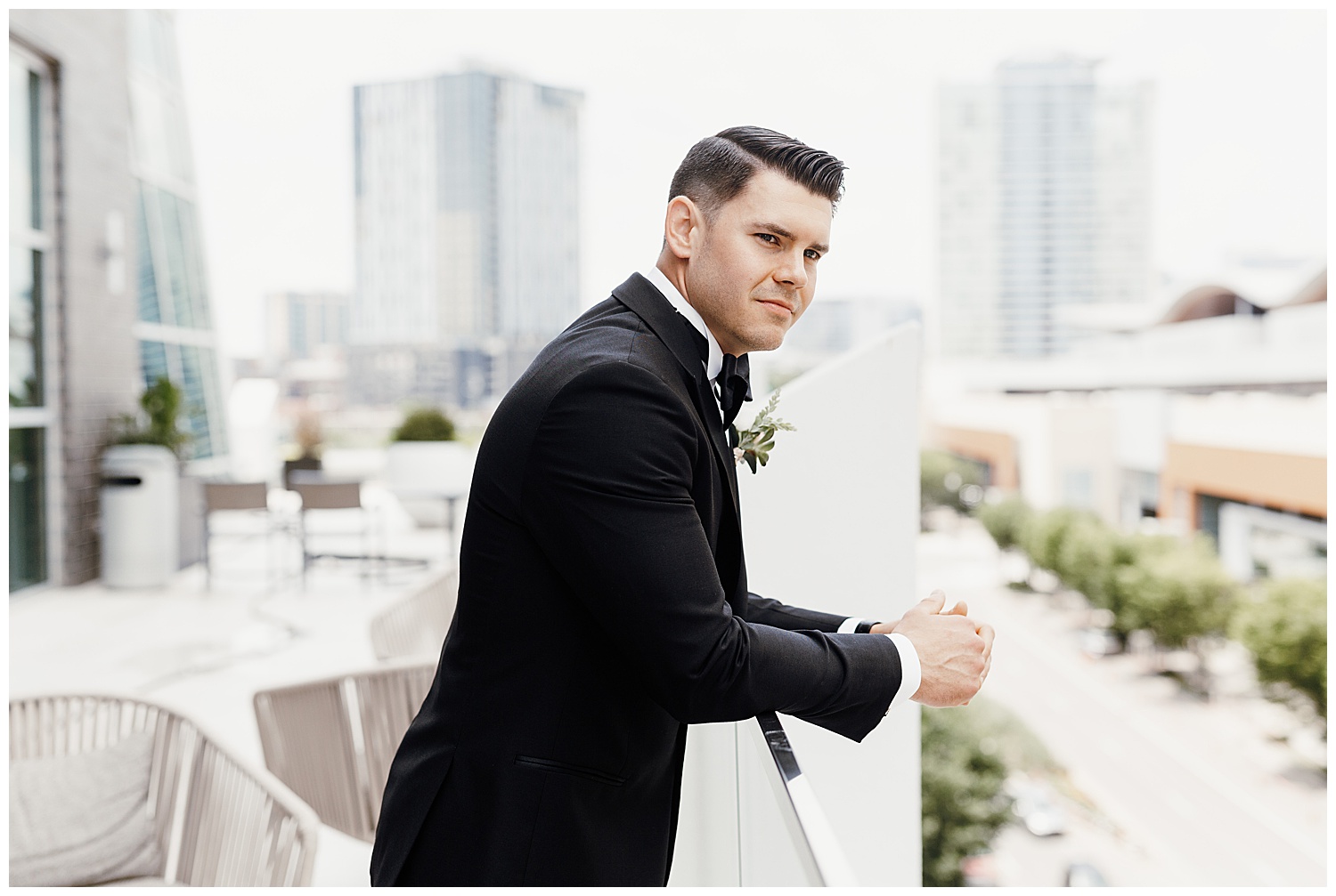 man overlooking downtown Nashville in black tuxedo, Nashville wedding photography, Country Music Hall of Fame wedding reception, Tennessee wedding Planning, Wedding Inspiration, Downtown Nashville